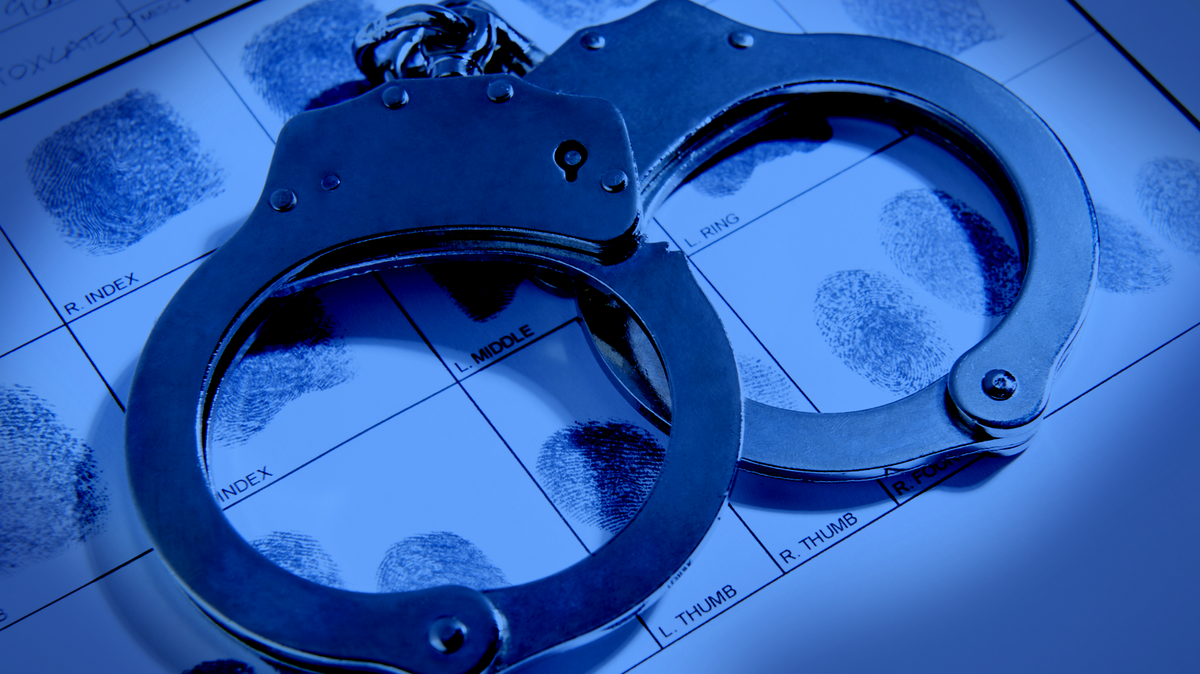 Generic illustration showing handcuffs and a fingerprint index